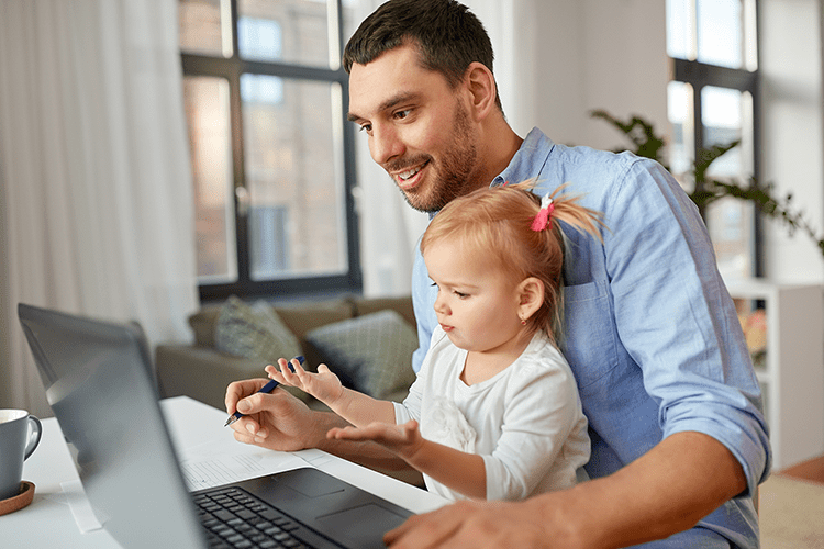 dad working at home with child